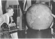 FDR looks at 50-inch globe that was presented to him by the United States Army, Dec. 1942. NPx …