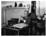 Photograph NPx 66-38(1); FDR working with his stamp collection, May 5, 1936. Franklin D. Roosev…