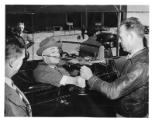 FDR accepts a model A-24 dive bomber from Otis Smallwood at the Douglas Aircraft plant, Tulsa, …